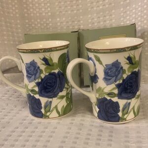 2 Royal Bone China matching mugs. Beautiful blue roses pattern. 4 in. tall. New.